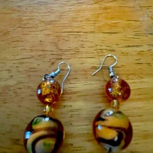 These earrings are the tiger eye. The woman who wears these will be in charge